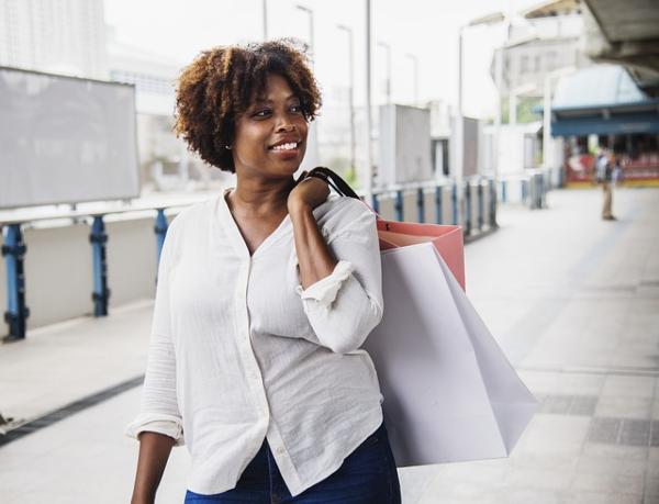 Female customer walking with shopping bag.jpg